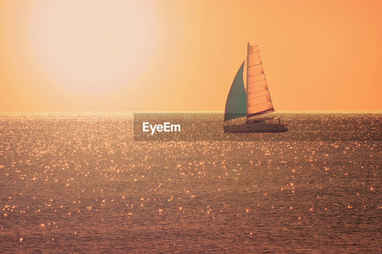 Lone sailboat in calm sea