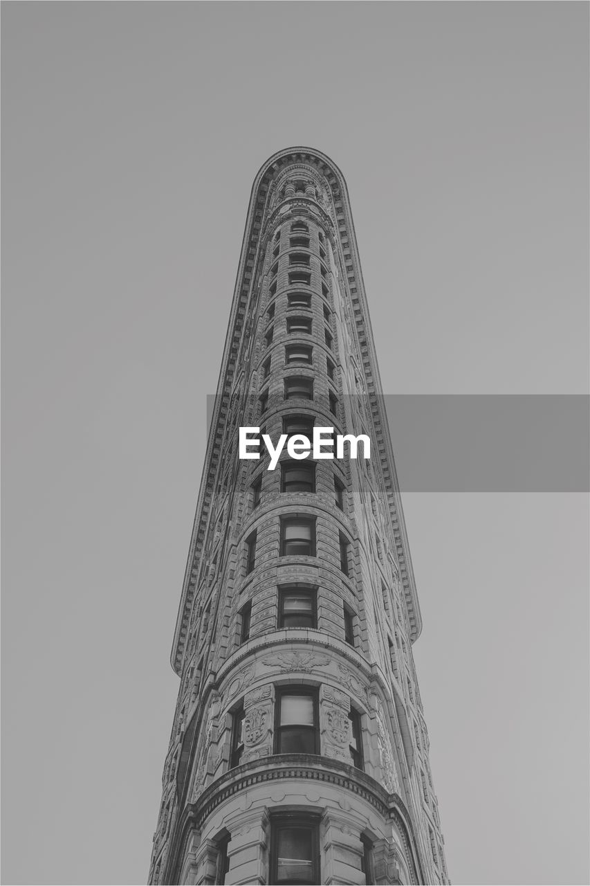 Low angle view of office building against sky