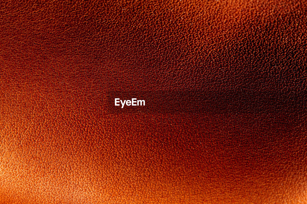 Full frame shot of orange leather