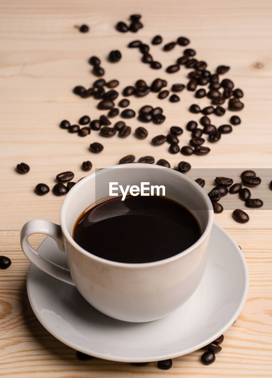 HIGH ANGLE VIEW OF COFFEE CUP WITH TEA