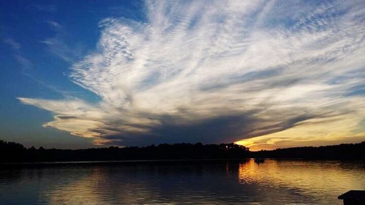 SCENIC VIEW OF LAKE AT SUNSET