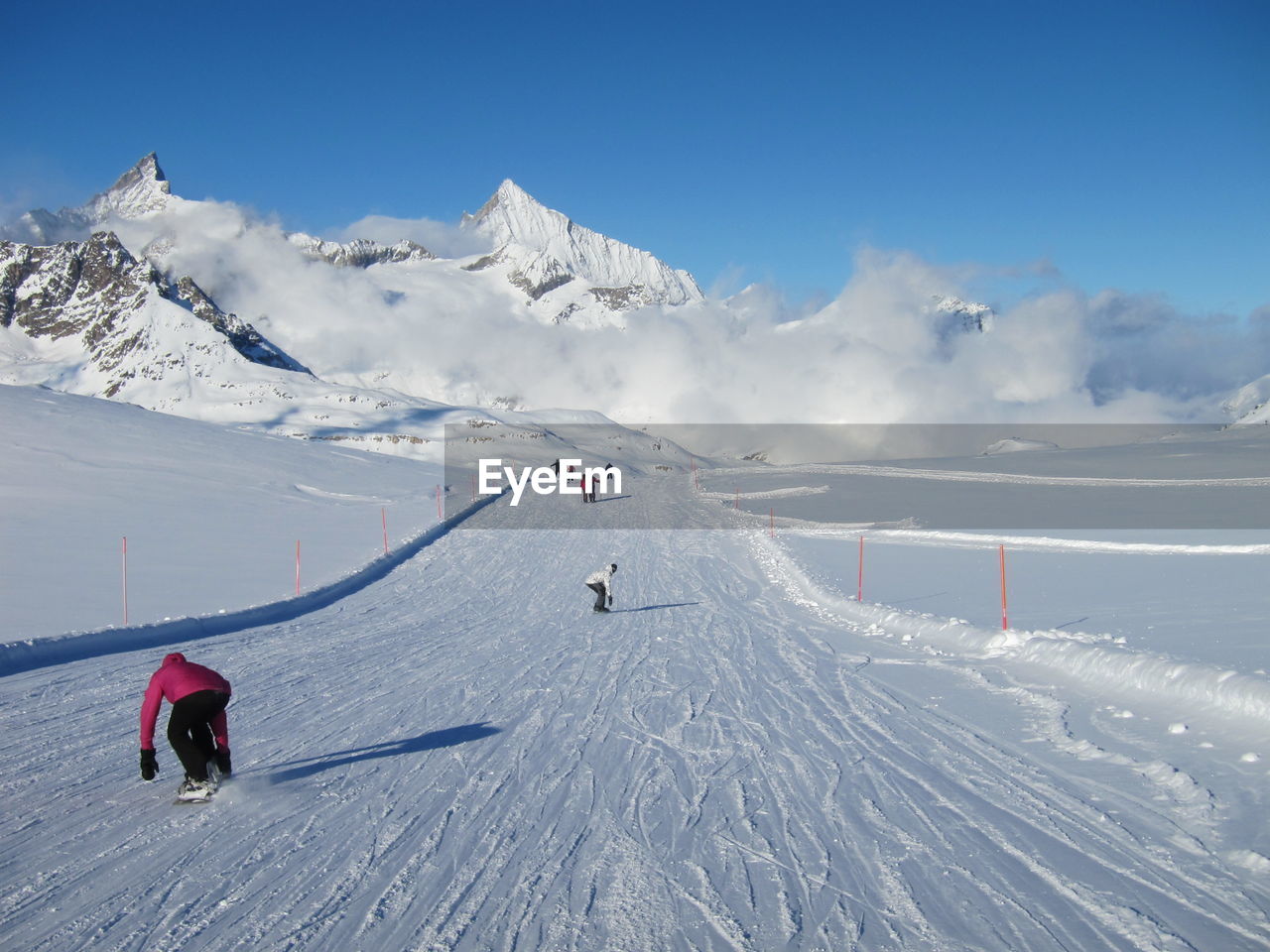 People skiing on snowcapped mountain