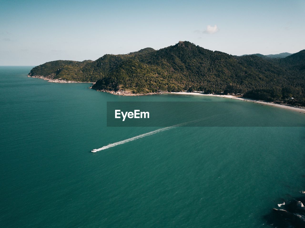 High angle view of sea and mountains against sky