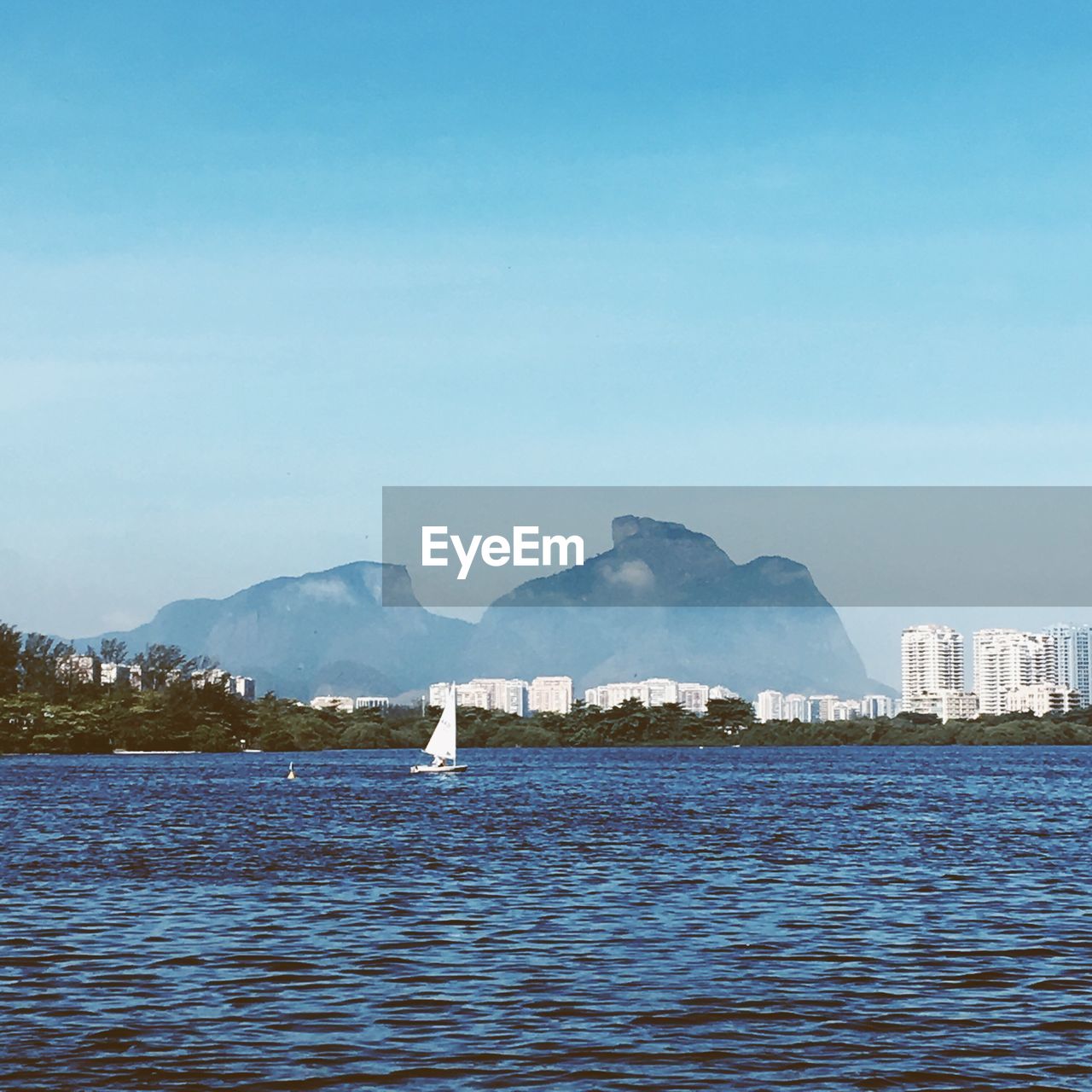 Scenic view of sea against blue sky