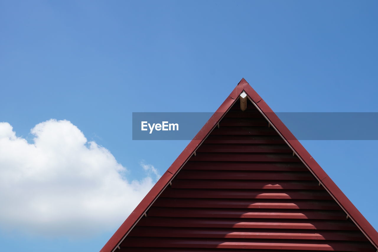 Low angle view of built structure against blue sky