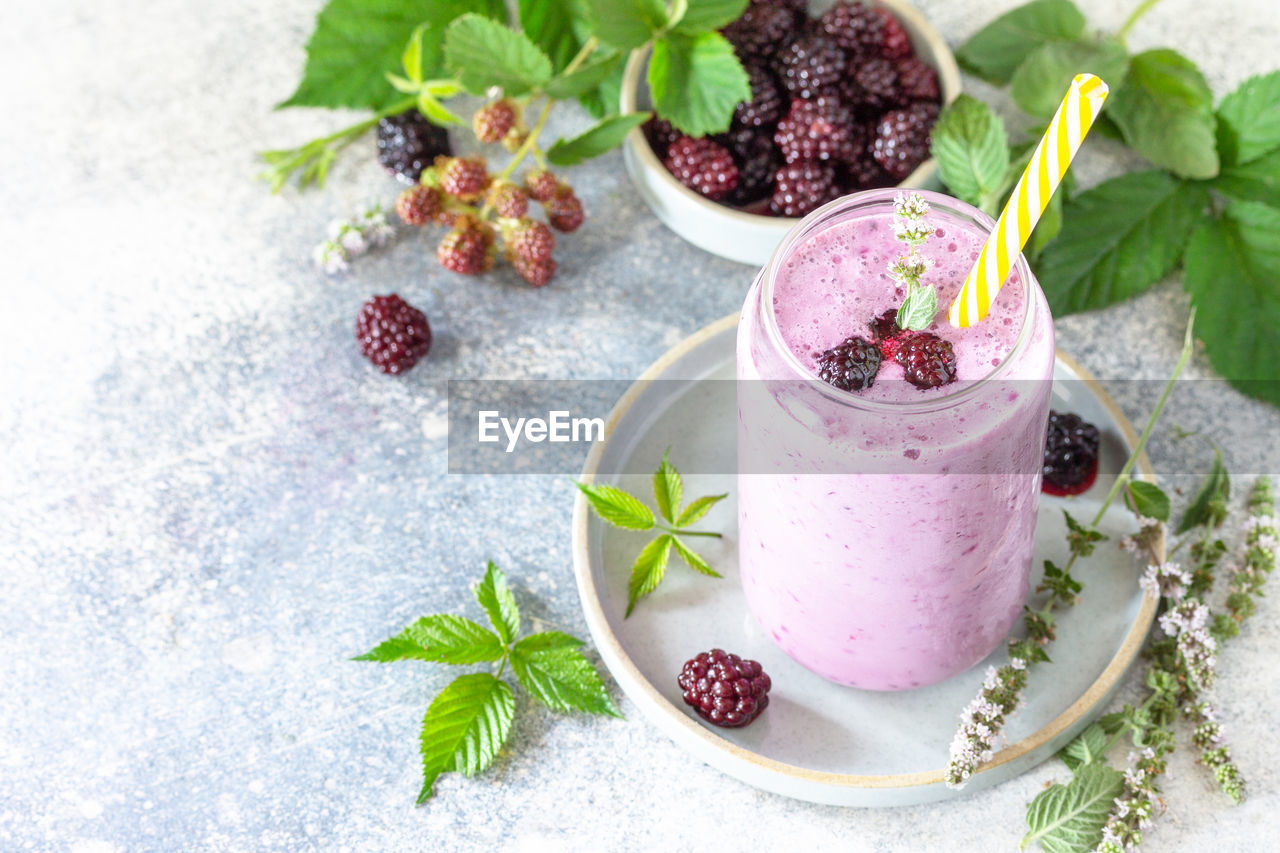 Natural healthy detox, fruit dessert, healthy dieting concept. blackberry milk shake. 