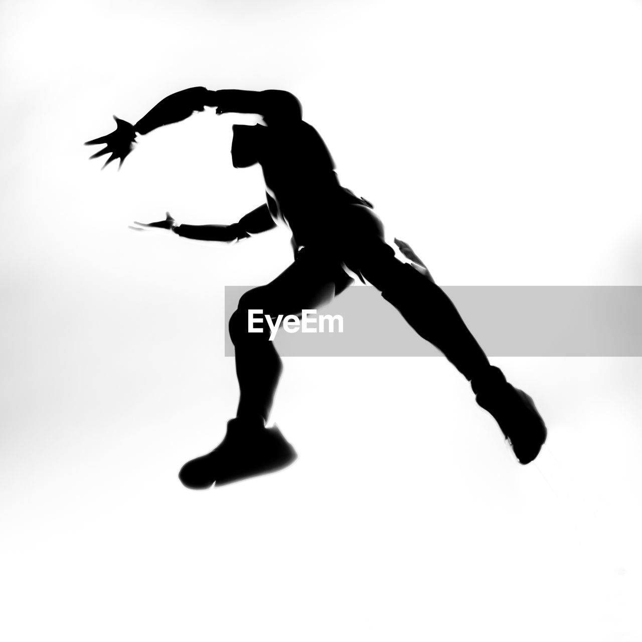 Silhouette man running against white background