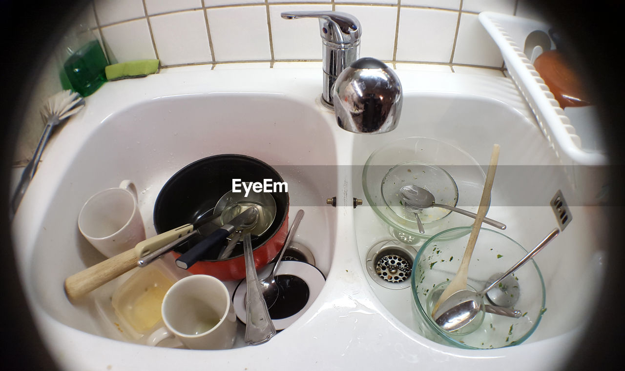 High angle view of dirty dishes in sink