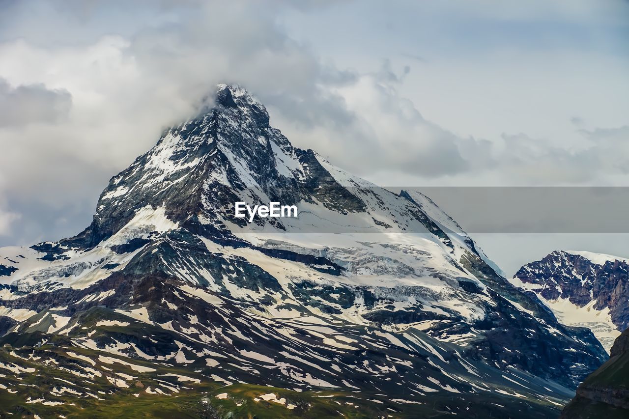 Scenic view of snowcapped mountain against sky