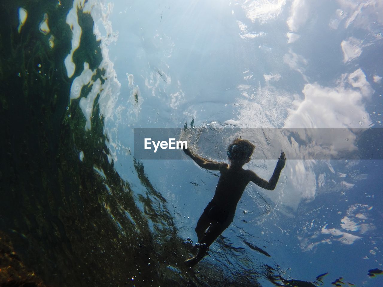 Boy swimming in sea