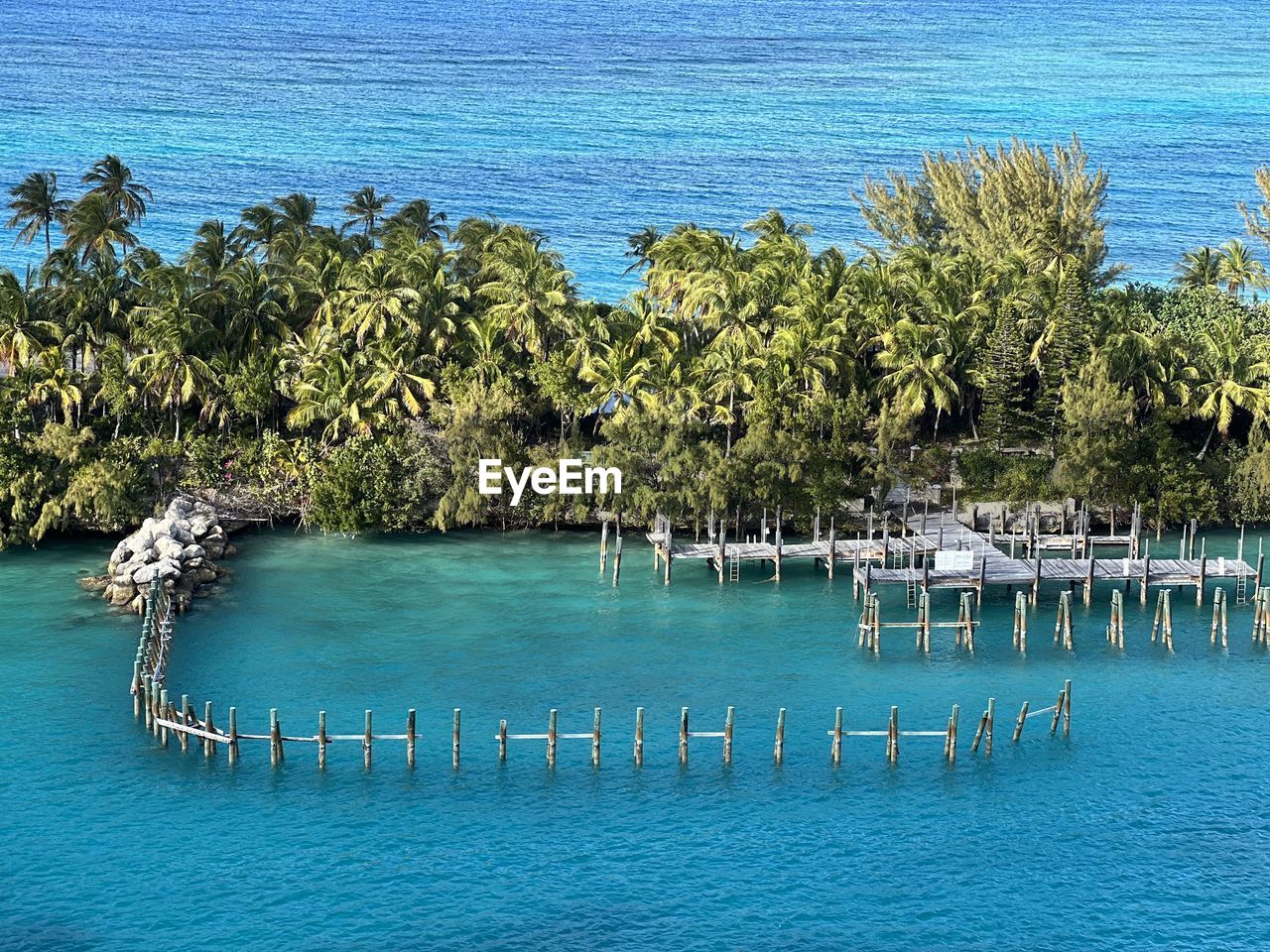 Scenic view of sea against sky and small island 