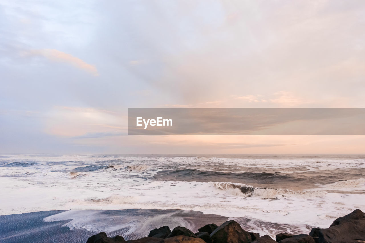 Scenic view of sea against sky during sunset