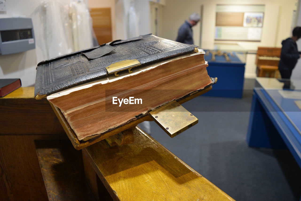 Close-up of bible on table in museum