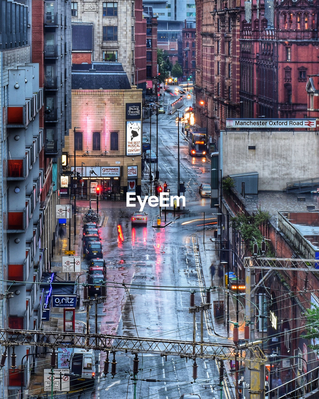 View of city street and buildings during rainy season