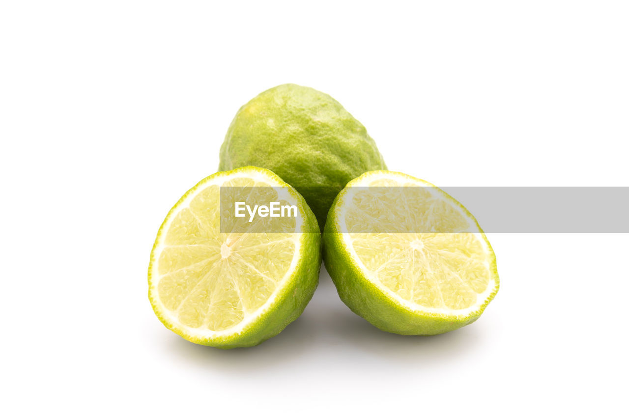 food and drink, food, fruit, healthy eating, lime, citrus fruit, citrus, freshness, slice, wellbeing, studio shot, white background, cut out, produce, cross section, indoors, lemon, plant, no people, green, refreshment, close-up, still life, group of objects, copy space