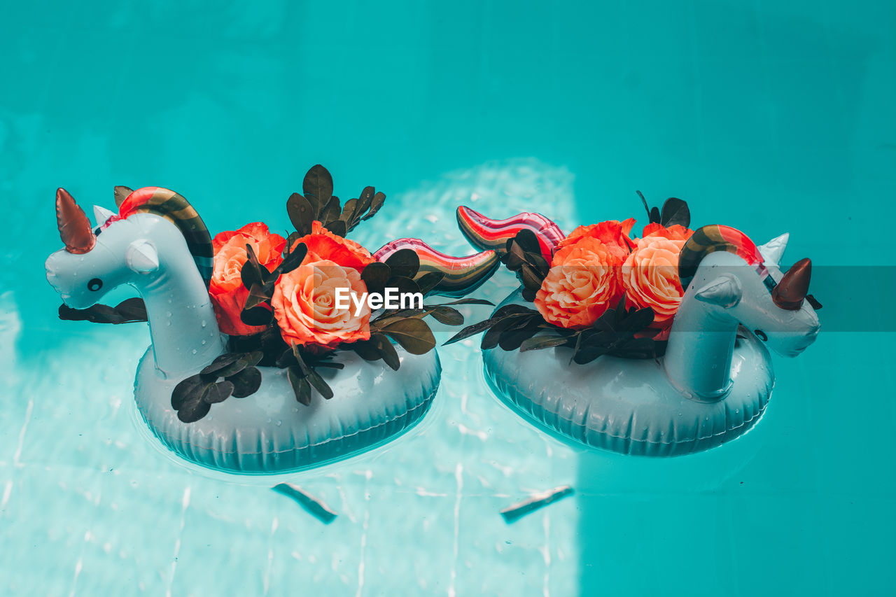 High angle view of inflatable unicorn decor on swimming pool 