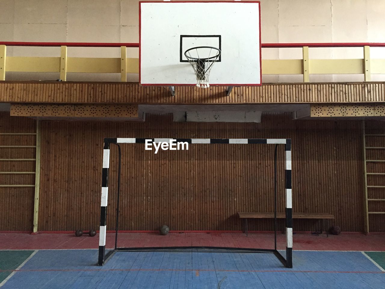 Basketball hoop mounted on wall in clubhouse