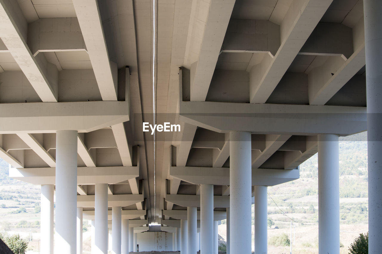 LOW ANGLE VIEW OF ARCHITECTURAL DETAIL OF CONCRETE STRUCTURE