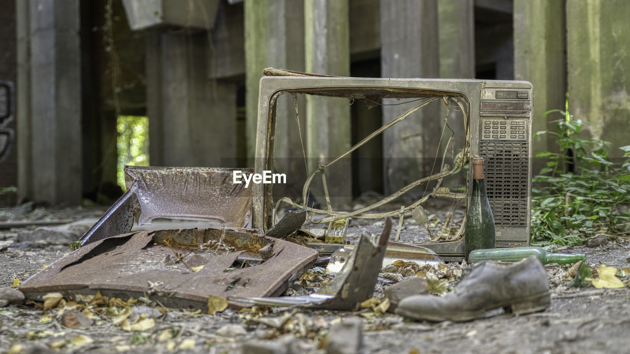 ABANDONED CHAIR IN RUSTY METAL