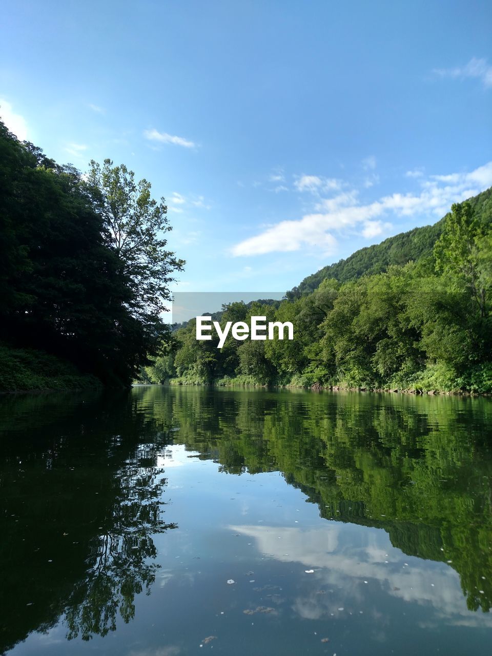 SCENIC VIEW OF LAKE AND MOUNTAINS