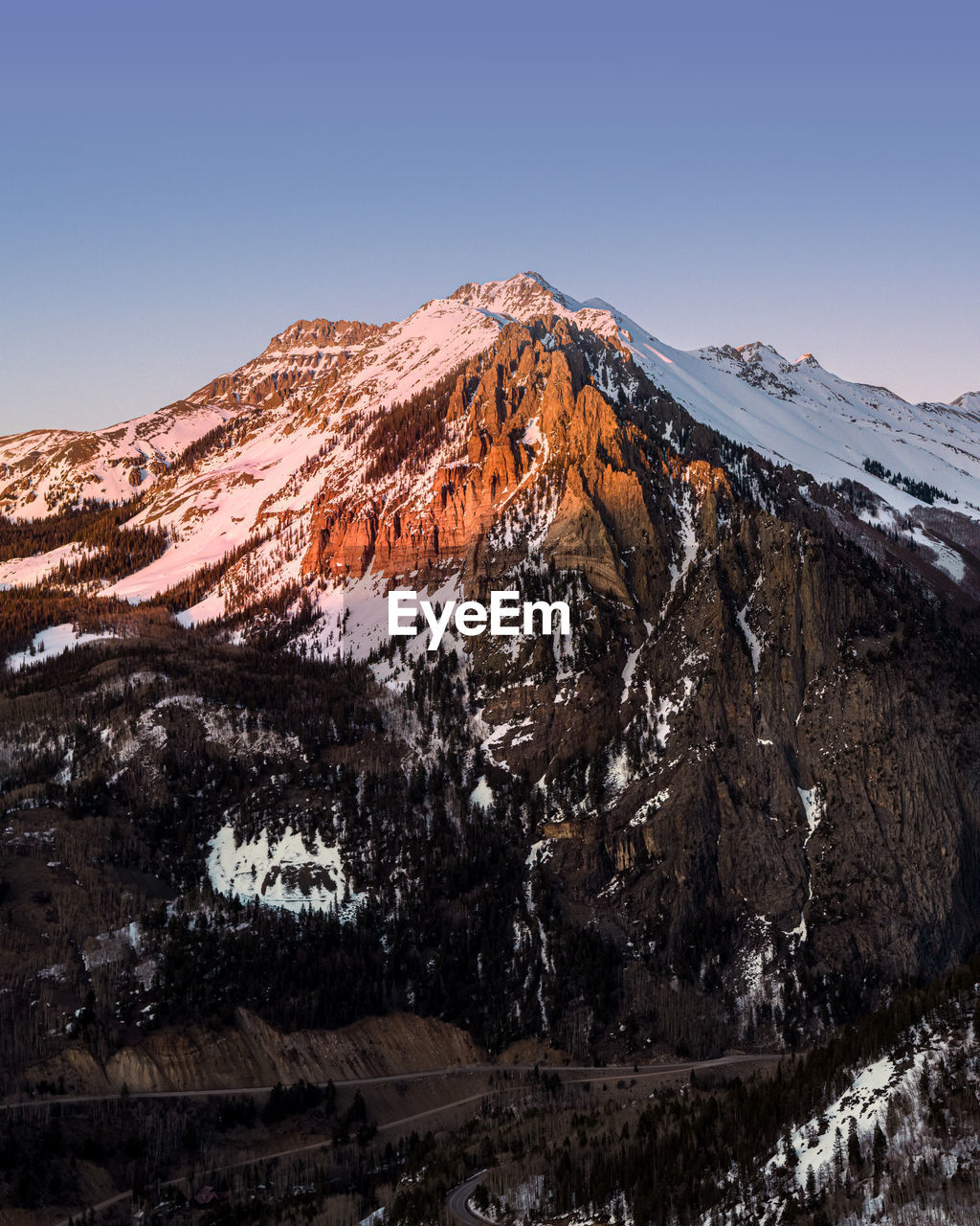 Scenic view of snowcapped mountains against clear sky