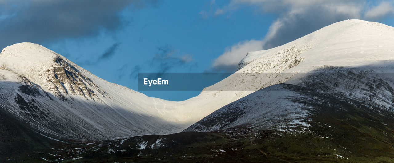 Scenic view of snowcapped mountains against blue clear sky