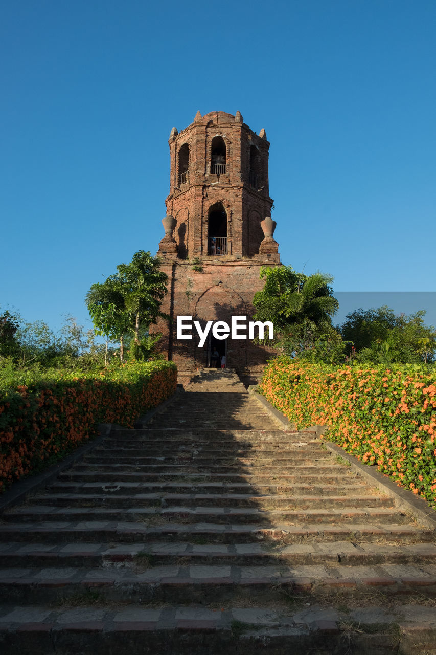 STEPS OF OLD BUILDING AGAINST SKY