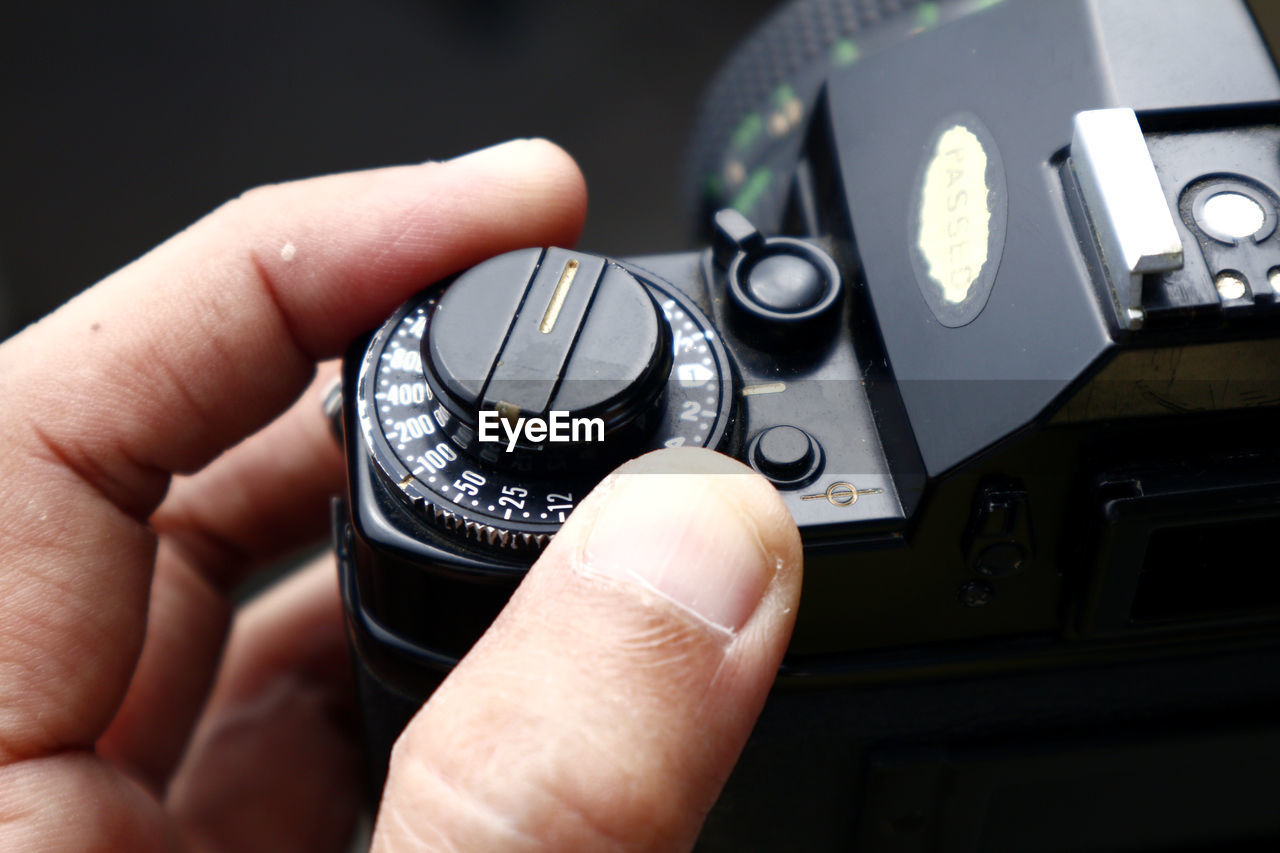 Close-up of person holding camera