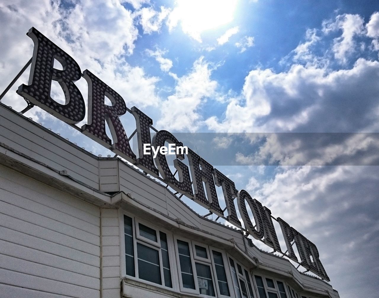 Low angle view of building against cloudy sky