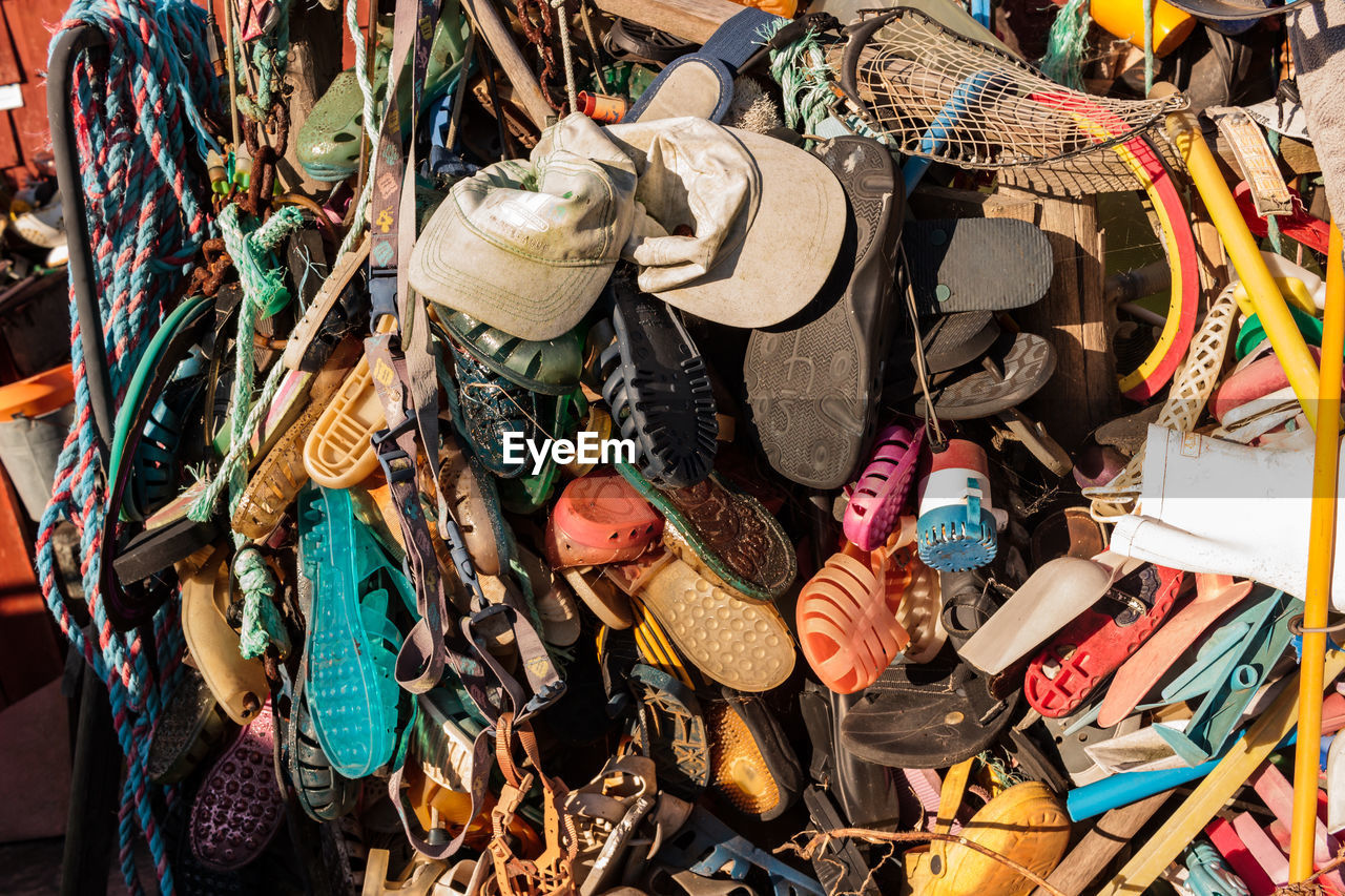 Various abandoned objects hanging at junkyard