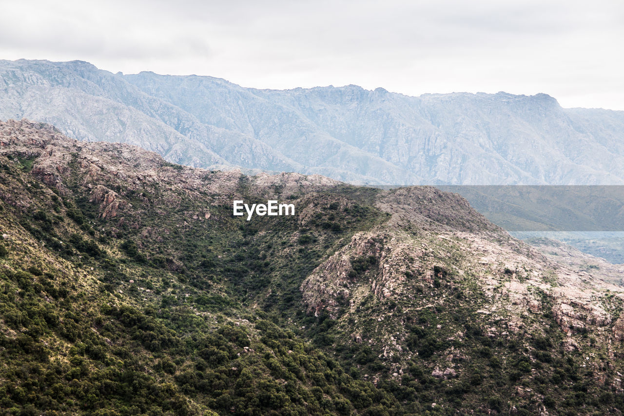 Scenic view of landscape and mountains against sky