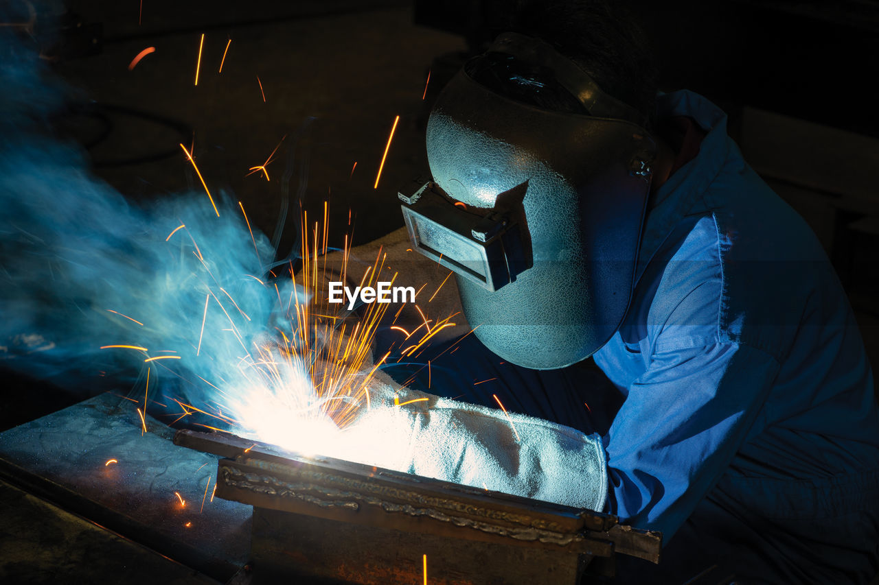 A male worker chia steel in an industrial factory. concept industry.