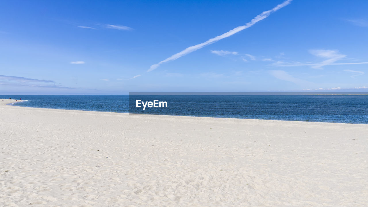 Scenic view of sea against blue sky island of sylt