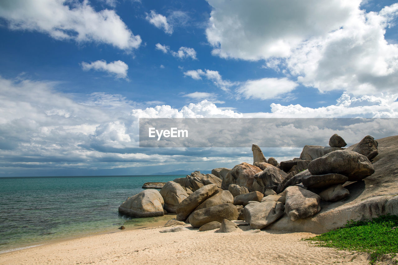 sky, sea, water, land, cloud, rock, beach, shore, nature, vacation, ocean, scenics - nature, coast, beauty in nature, sand, body of water, travel destinations, tranquility, no people, environment, travel, horizon, landscape, tranquil scene, day, outdoors, coastline, horizon over water, blue, holiday, trip, relaxation, summer, tourism