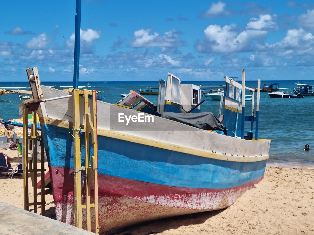 water, sea, nautical vessel, beach, transportation, sky, land, vacation, mode of transportation, nature, vehicle, sand, cloud, boat, long-tail boat, moored, travel, travel destinations, coast, blue, no people, day, sunlight, scenics - nature, ocean, tranquility, outdoors, shore, watercraft, coastline, beauty in nature, ship, trip, tranquil scene, holiday, tropical climate, horizon, horizon over water, tourism, fishing, fishing industry, island, wood, pier