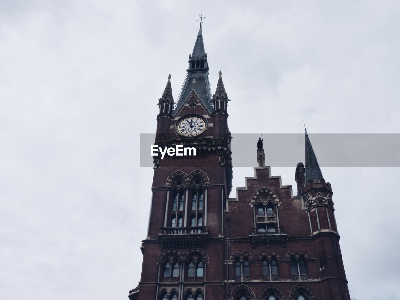 Low angle view of clock tower against sky