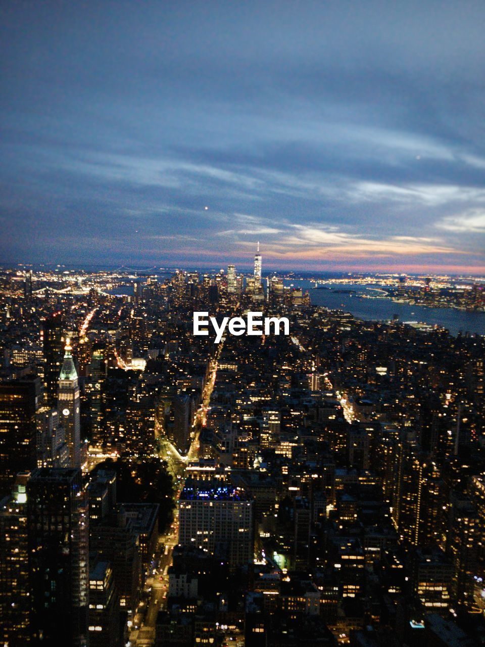 Aerial view of illuminated buildings in city at night