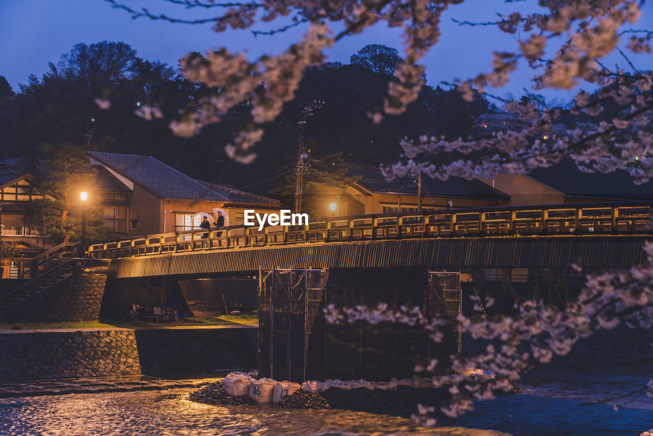 evening, architecture, night, built structure, illuminated, dusk, reflection, nature, water, sky, building exterior, bridge, tree, no people, transportation, lighting equipment, city, travel destinations, building, plant, outdoors, sunset, travel, cityscape, river