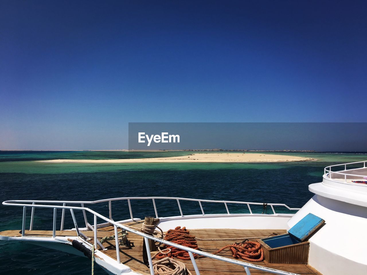 Scenic view of sea against clear blue sky