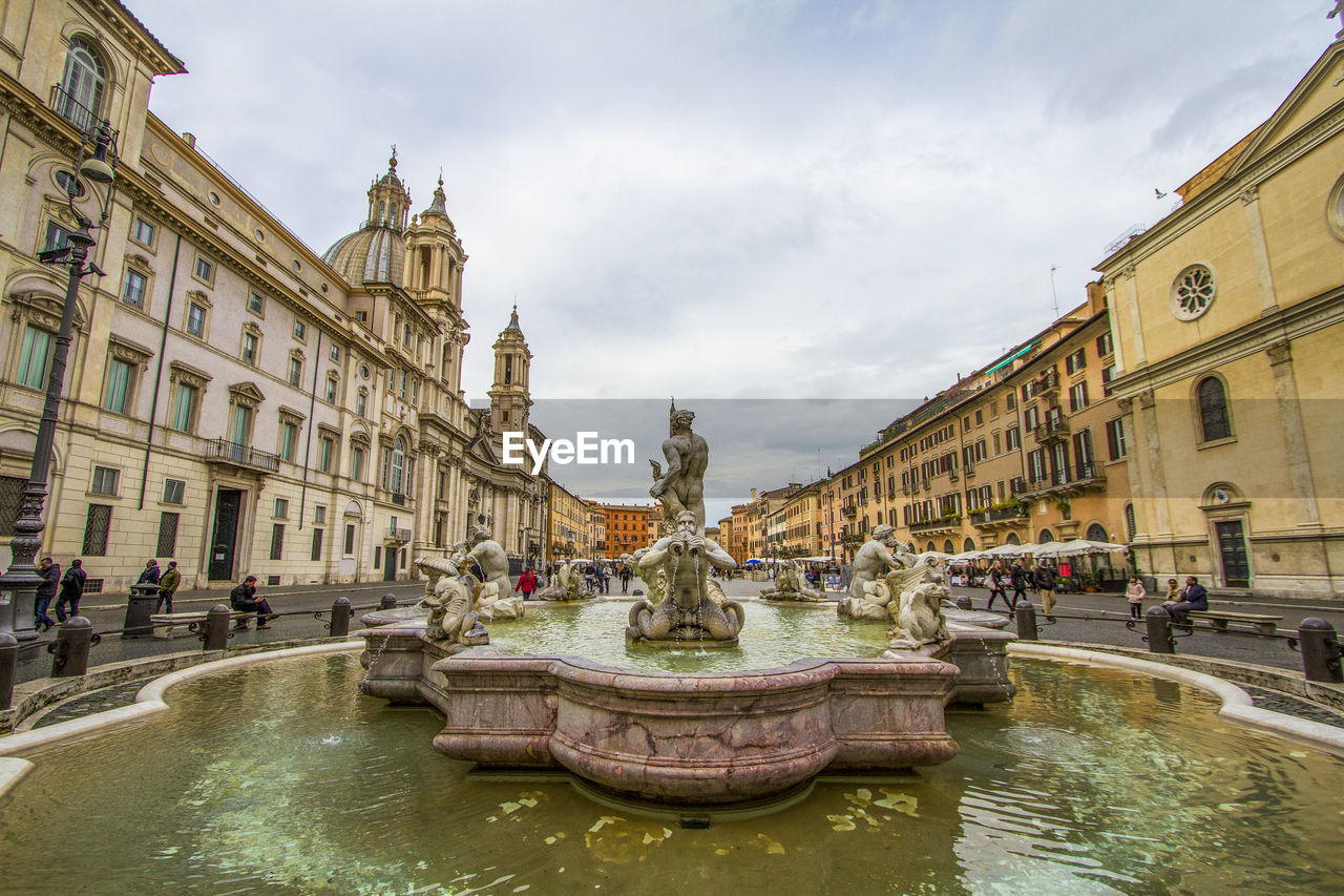 Fountain at piazza navona against cloudy sky