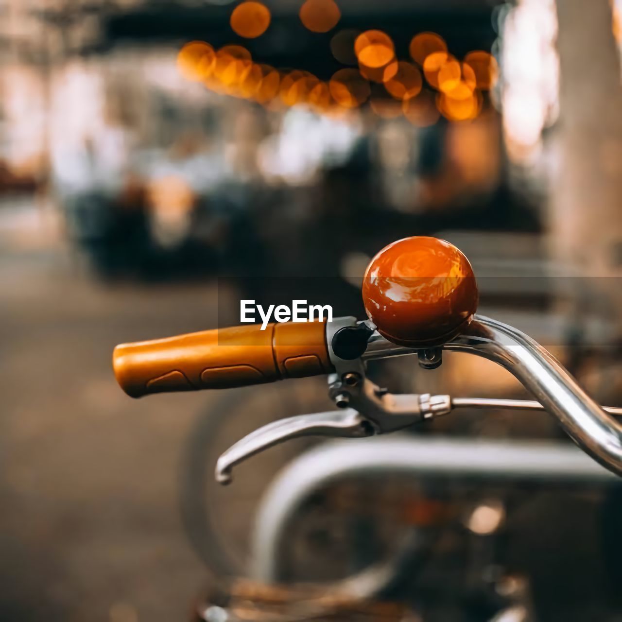 Close-up of illuminated bicycle on street