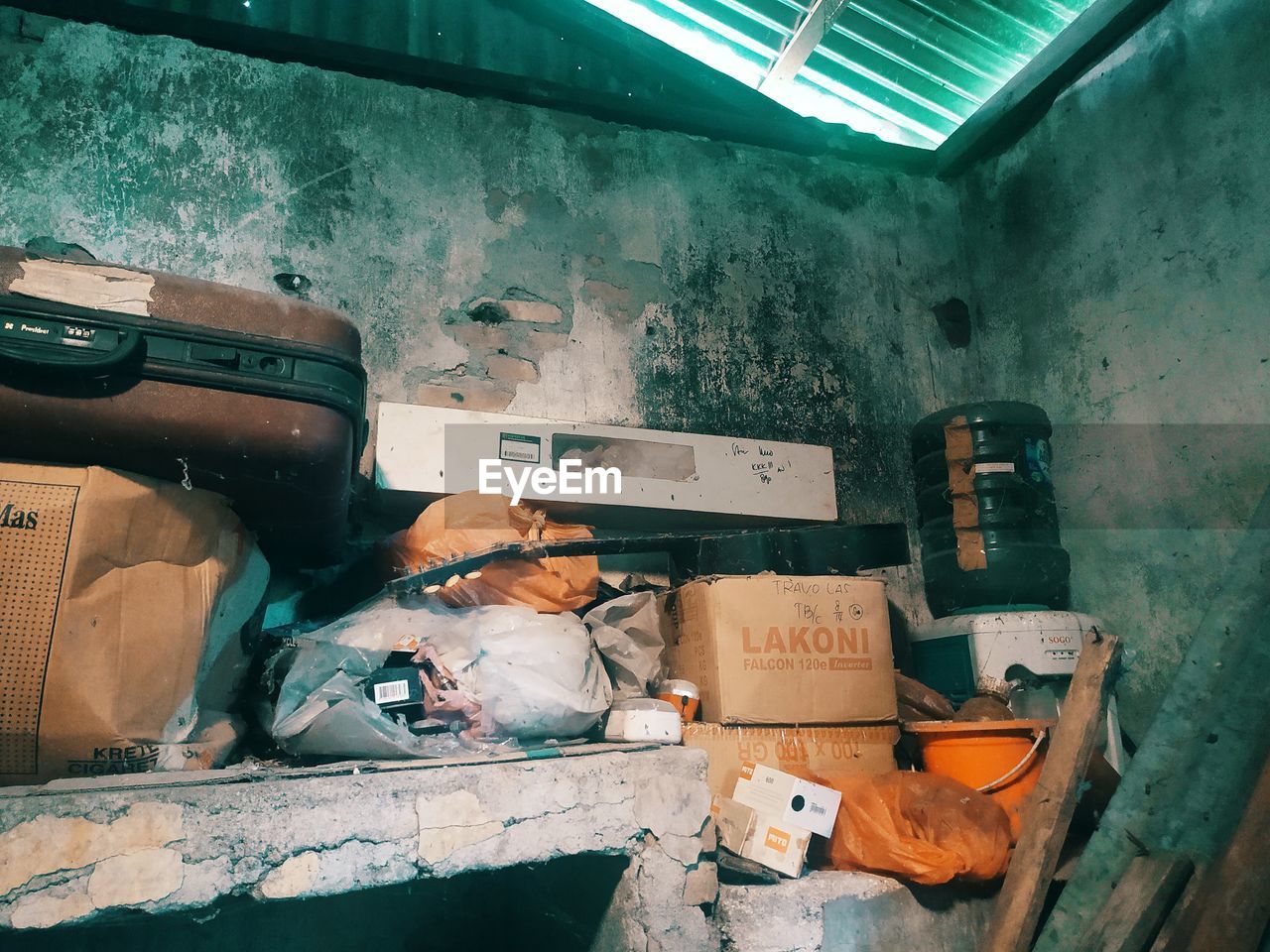 STACK OF GARBAGE IN ABANDONED BUILDING