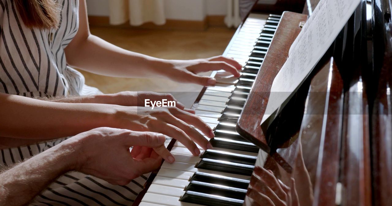A photo of a piano lesson