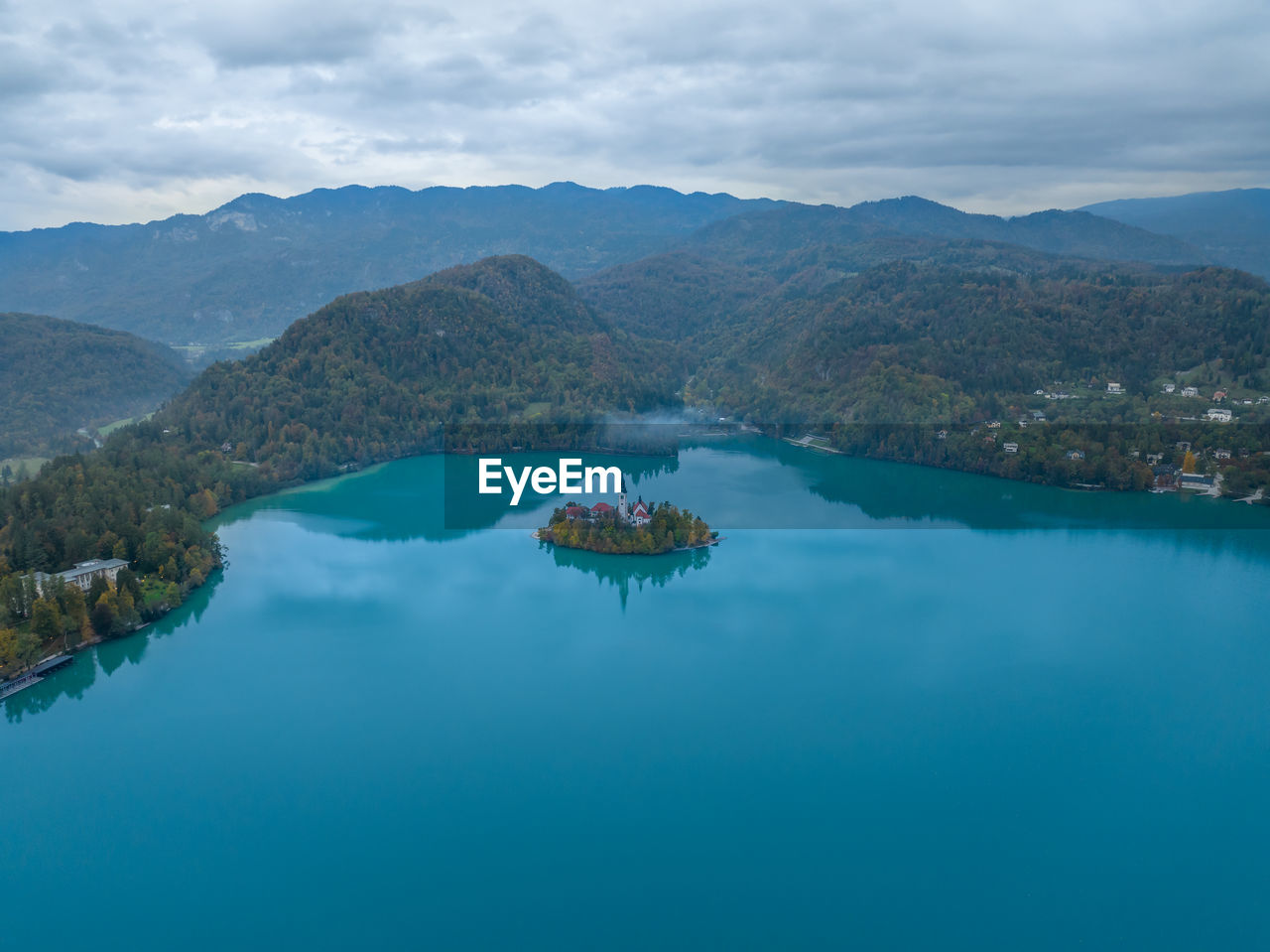 water, scenics - nature, mountain, lake, nature, beauty in nature, environment, sky, landscape, cloud, tranquility, land, reservoir, no people, reflection, travel destinations, travel, tranquil scene, blue, mountain range, nautical vessel, body of water, outdoors, day, crater lake, turquoise colored, tree, idyllic, tourism, transportation, non-urban scene, high angle view, aerial view, beach, bay, architecture