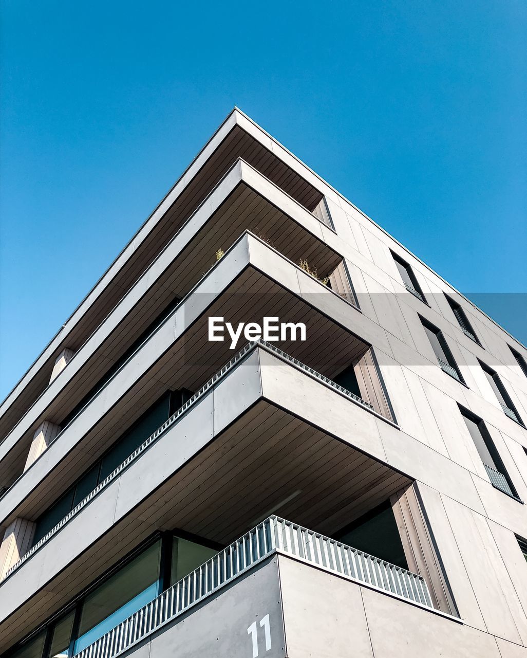 Low angle view of building against clear blue sky