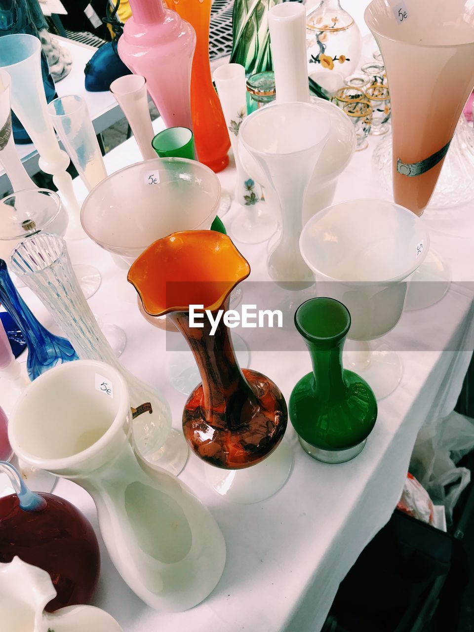 High angle view of various vases on table