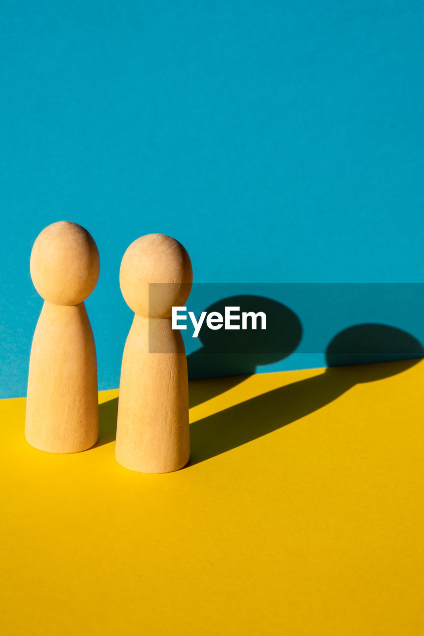 Close-up of chess pieces against blue background