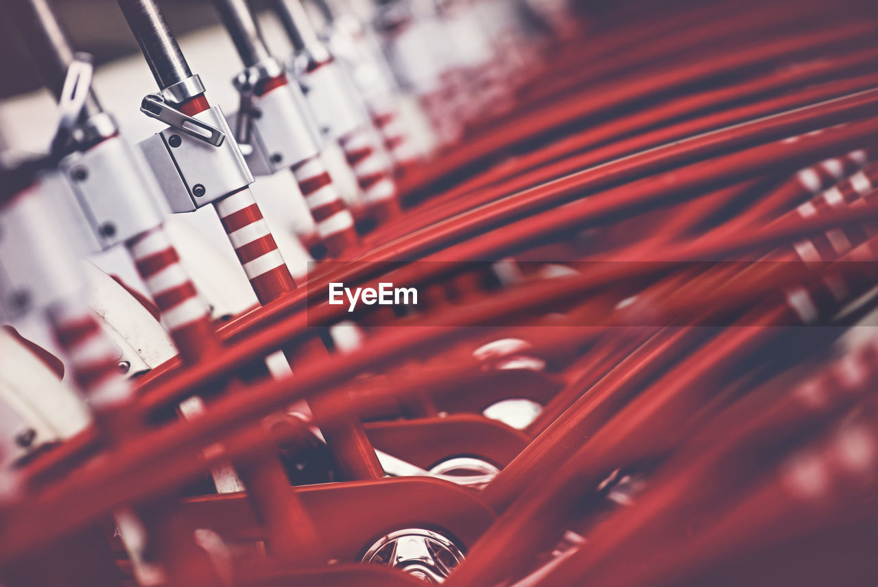 Row of red bicycles parked in rack