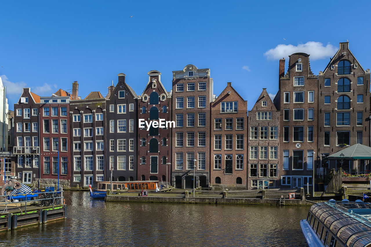 View of buildings against blue sky