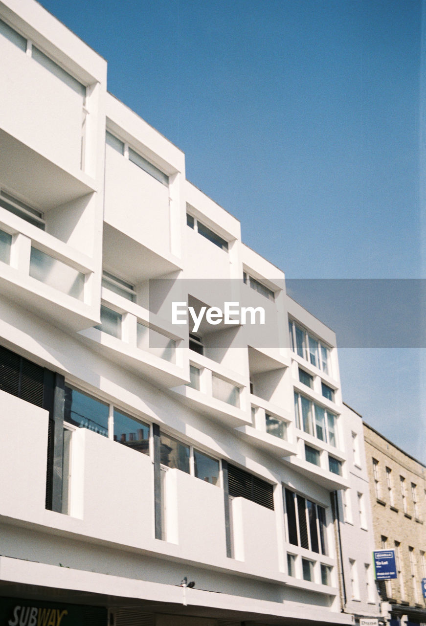 Low angle view of residential building against clear sky